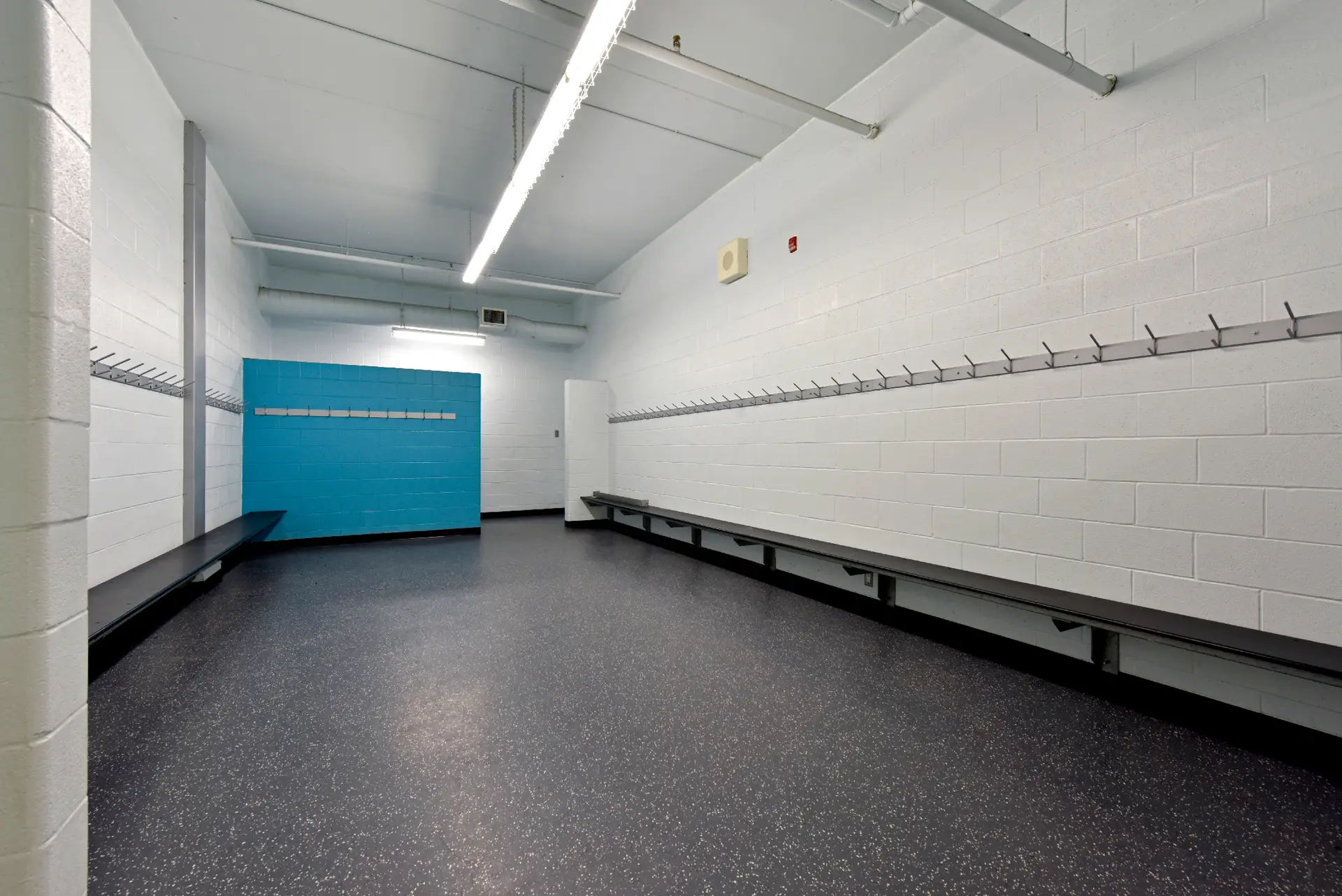 Players changing room with skate-resistant rubber flooring