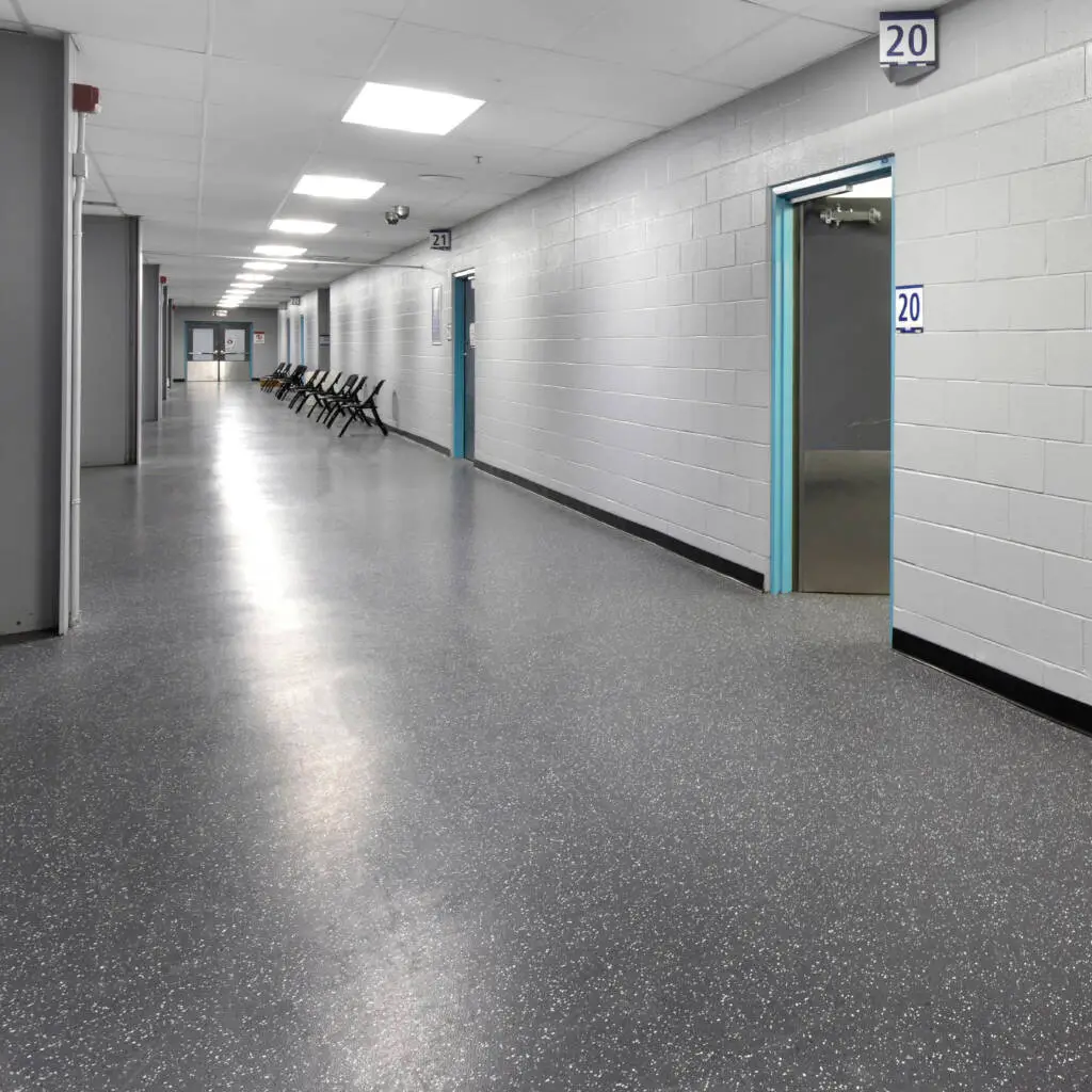 Skate-resistant rubber flooring in an arena ice rink corridor