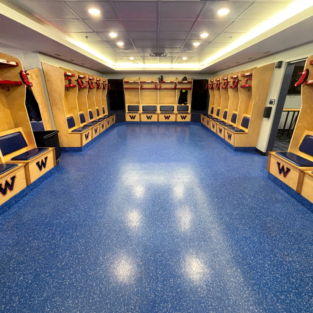 Arena changeroom with blue skate-resistant rubber flooring